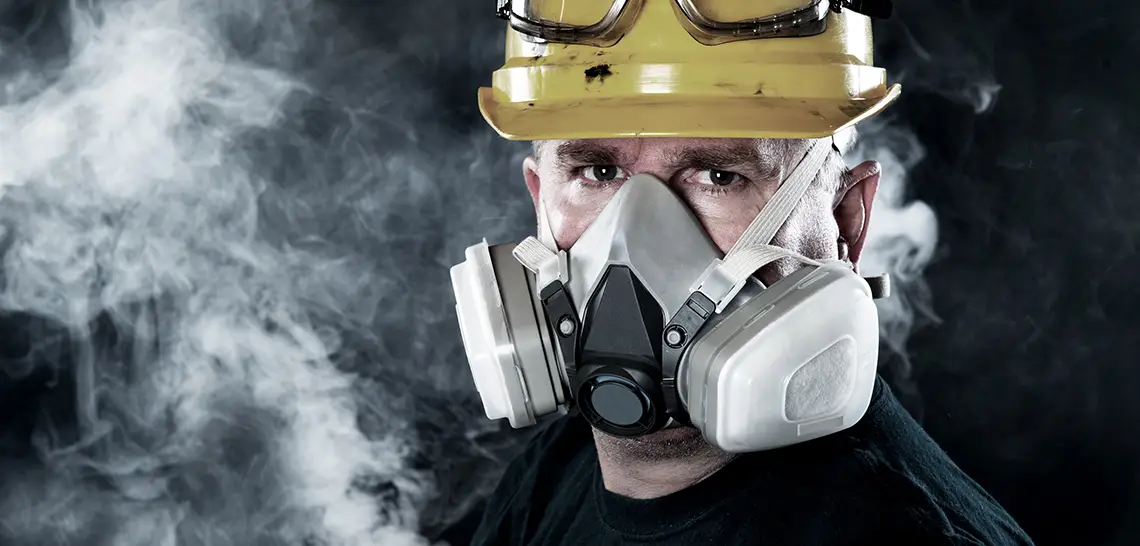 Worker wearing a respirator