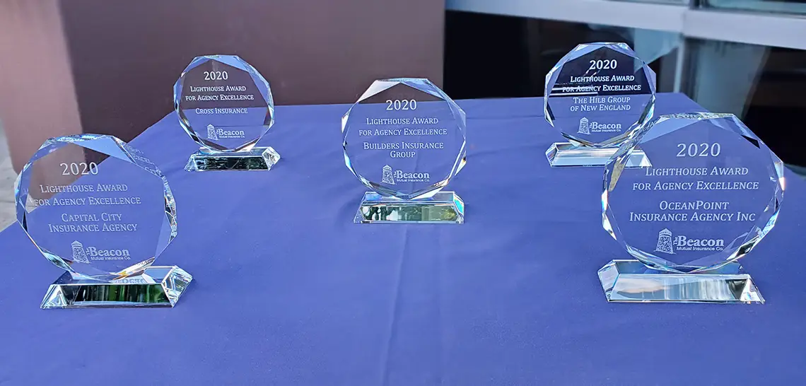 Table with Lighthouse Awards on display